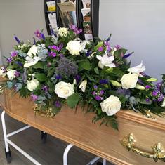 Purple and white coffin spray 