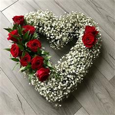 Open gypsophila and red rose heart 