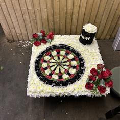 Dart board with pint 