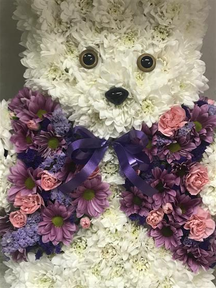 Purple teddy shop bear with flowers